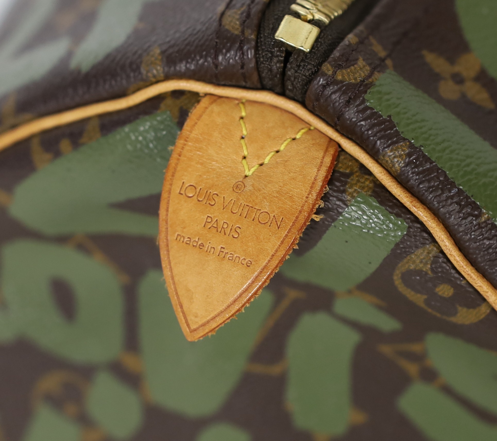A vintage 2001 Louis Vuitton Stephen Sprouse Khaki Green Monogram Graffiti Keepall 50